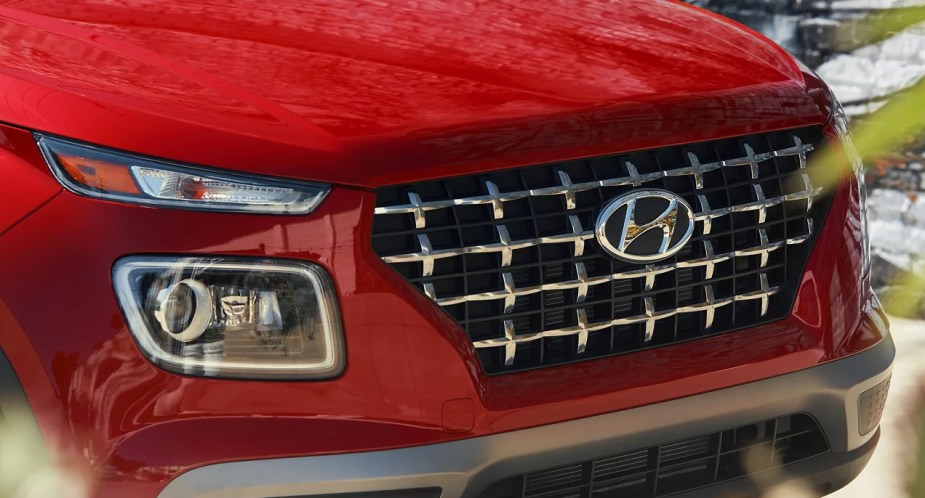 The front of a red 2023 Hyundai Venue subcompact SUV.
