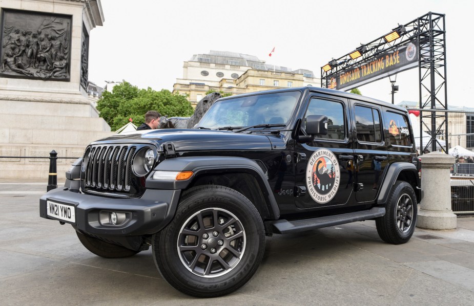 A black Jeep Wrangler Unlimited with door badges as a tribute to the Jurassic Park film franchise.