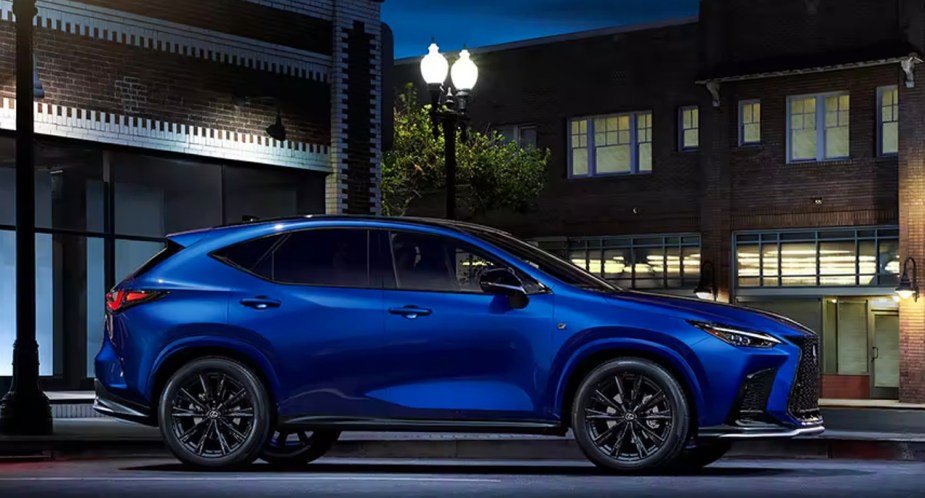 A blue 2023 Lexus NX 350h small luxury hybrid SUV is parked. 