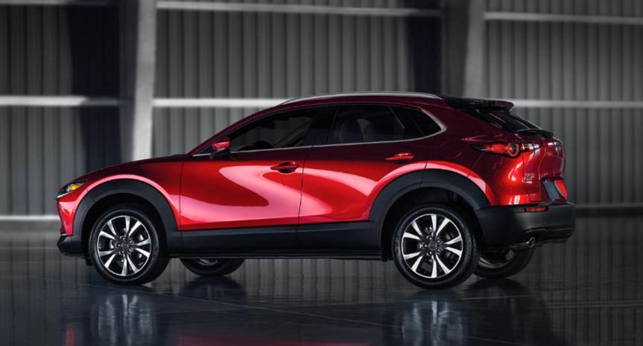 A red Mazda CX-30 subcompact SUV is parked. 