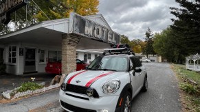 Mini Cooper packed up in front of a motel while traveling with a newborn
