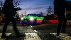 A Mini Cooper covered in Christmas lights.