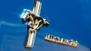 The classic Ford Mustang logo is an emblem of a Mustang running.