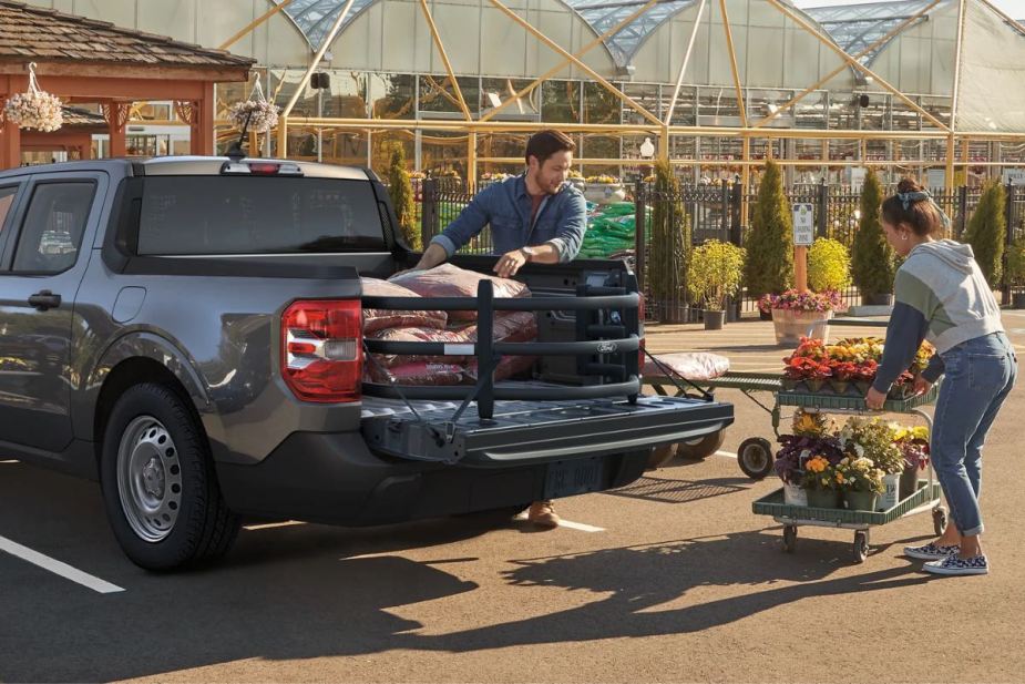 People loading the bed of the 2023 Ford Maverick, the only pickup under $25,000 recommended by Consumer Reports