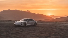 A Porsche Taycan luxury car parked at dusk