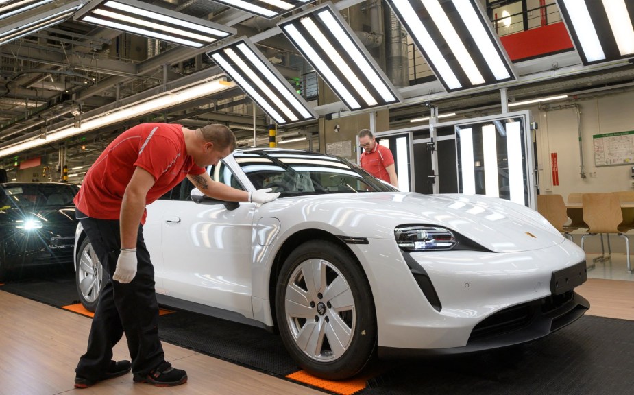 A vehicle fit-and-finish and reliability inspection of a Porsche Taycan electric sports car in Stuttgart, Germany