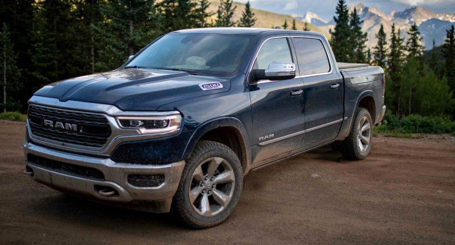A blue 2023 Ram 1500 full-size pickup truck is parked. 
