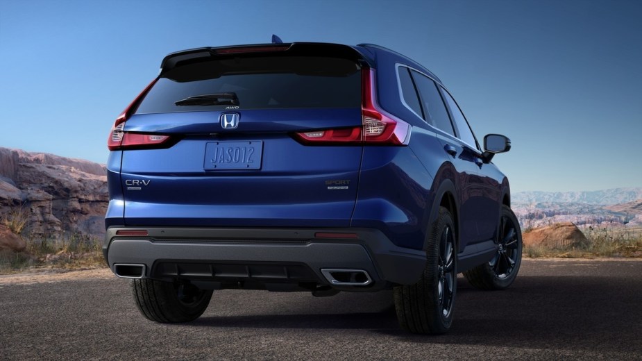 Rear angle view of blue 2023 Honda CR-V, highlighting what the “CR-V” acronym stands for in its name