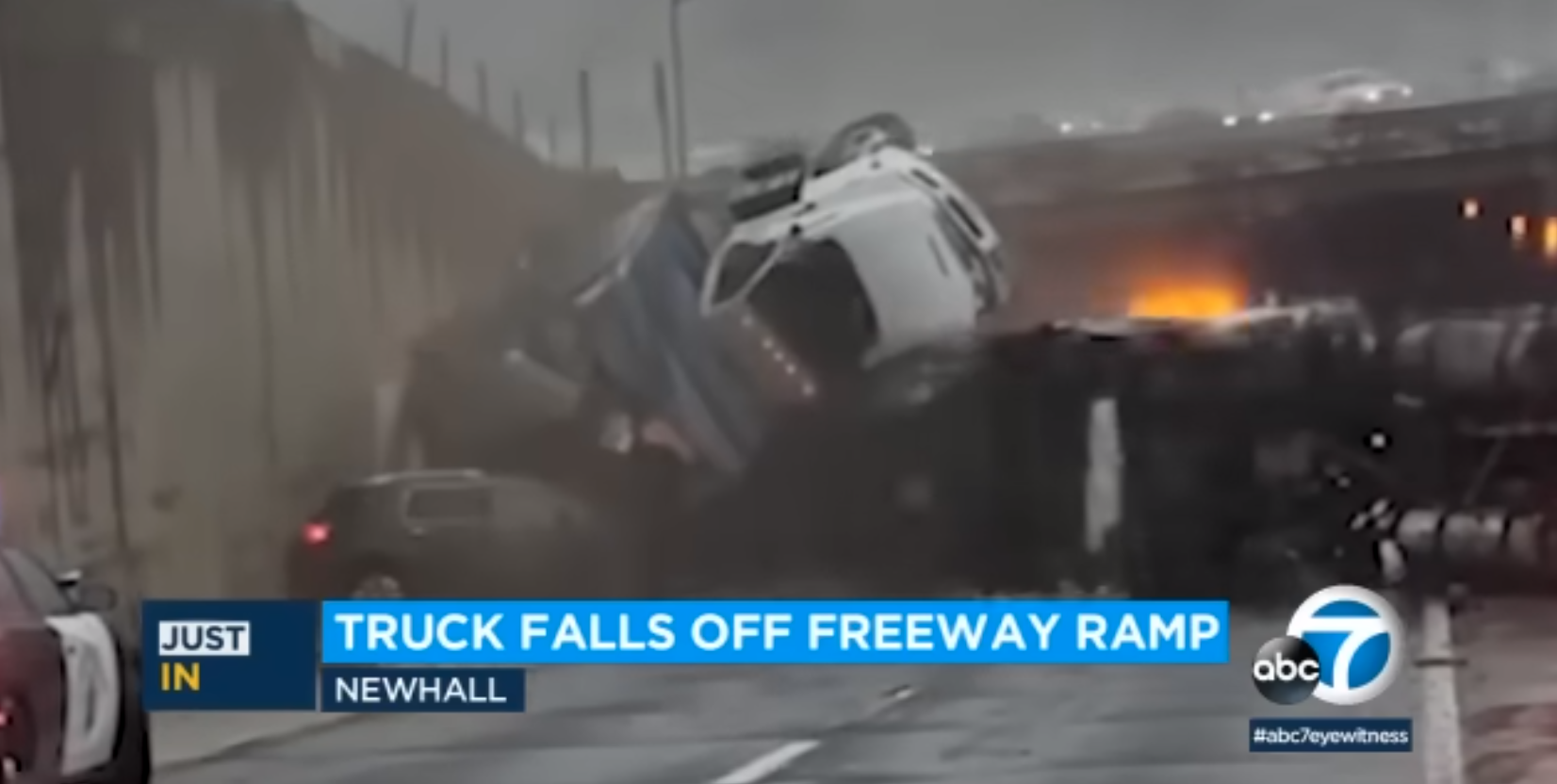 Semi-truck crash shows truck falling off overpass