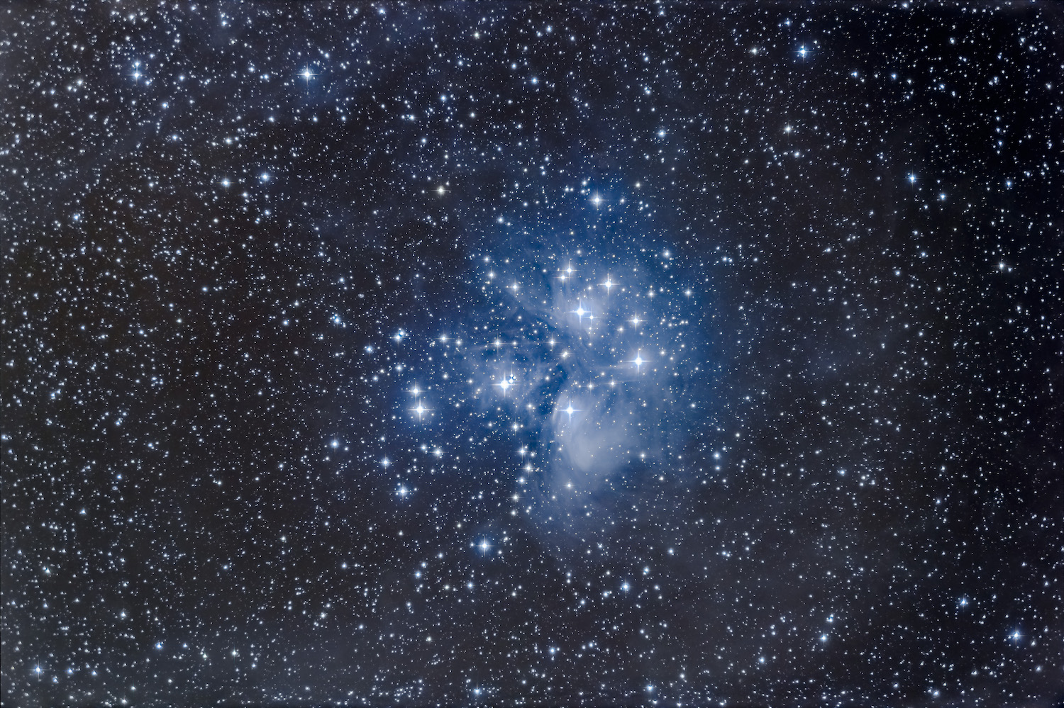 Telescope photo of the M45 constellation which  has the name Seven Sisters in the West, the Pleiades in Ancient Greek, and Subaru in Japan.