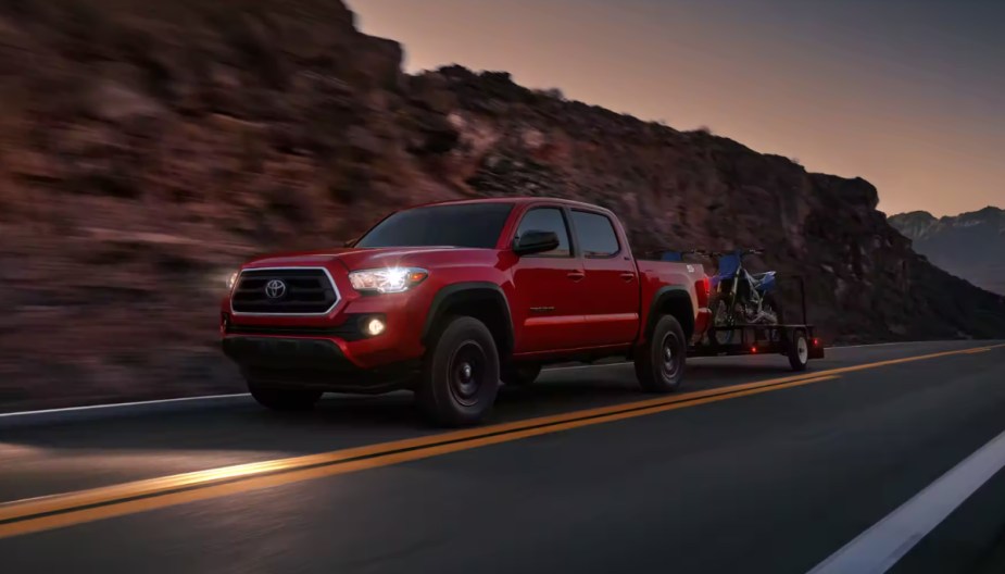 The 2023 Toyota Tacoma SR5 is a usable mid-size truck, here it is towing. 