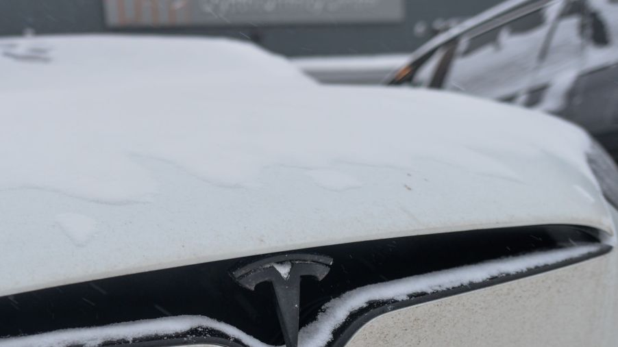 A Tesla EV with a heat pump covered in winter snow in Edmonton, Alberta, Canada