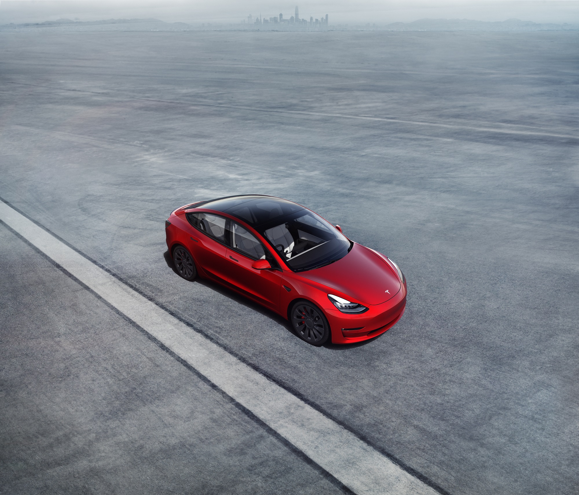 This red 2022 Tesla Model 3 boasts a Long Range trim.