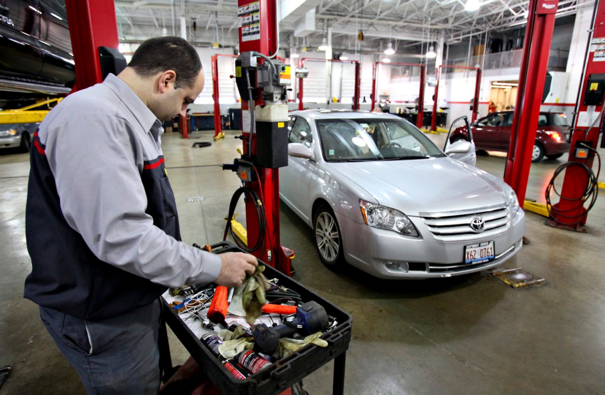 Service technician Frank Russo prepares to work on repairing an accelerator pedal on a recalled 2007 Toyota Avalon at Elmhurst Toyota in Elmhurst, Illinois, U.S., on Thursday, Jan. 4, 2010. Toyota Motor Corp., the world's largest carmaker, forecast a return to annual profit and a 51 percent surge in North American sales this quarter amid the company's worst recall crisis.