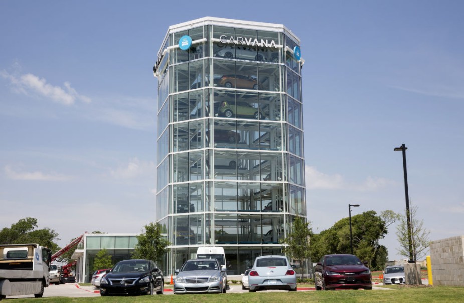 Vehicles sit parked outside the Carvana Co. car vending machine in Frisco, Texas, U.S.