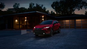 Comfortable and reliable SUVs under $45,000 like the Toyota Venza, one of the best midsize SUVs for 2023, pictured here in red.