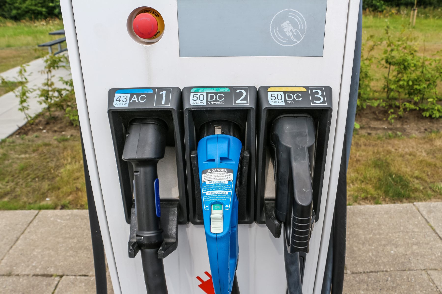An electric car EV charging station with AC and DC currents and CHAdeMO and CCS outlets