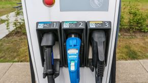 An electric car EV charging station with AC and DC currents and CHAdeMO and CCS outlets