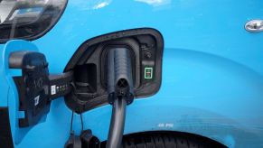 An electric vehicle (EV) battery charging outlet on a British Gas van at a Motor Fuel Group EV Power forecourt