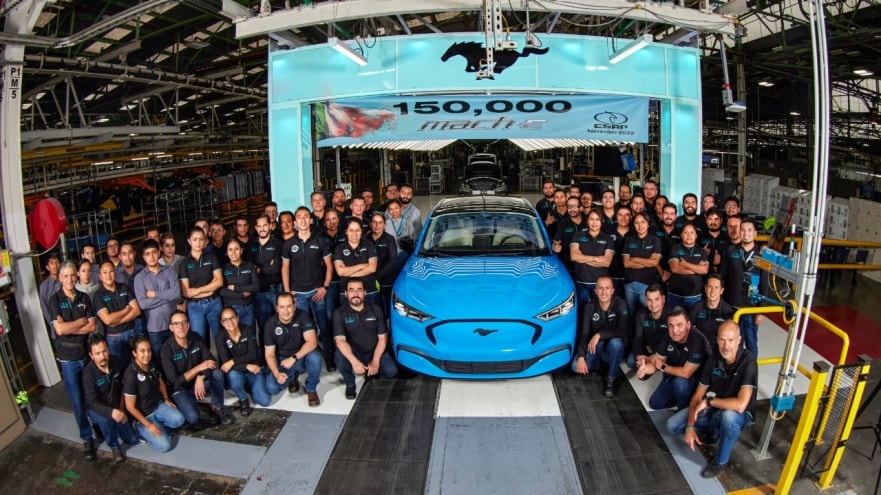 Ford employees celebrating the 150,000th Mach-E