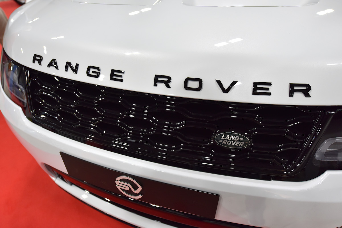 The Range Rover logo on a white Range Rover.