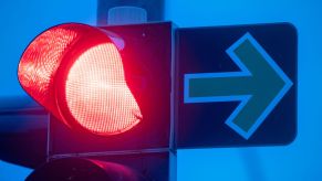 A red traffic light with a green arrow sign in the early morning in Mecklenburg-Western Pomerania, Stralsund