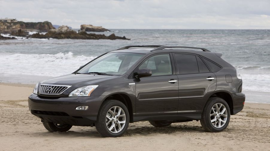 A 2008-2009 Lexus RX 350 Pebble Beach Edition model parked on a sandy beach near sea waves. This is one of the most reliable used SUVs to buy.