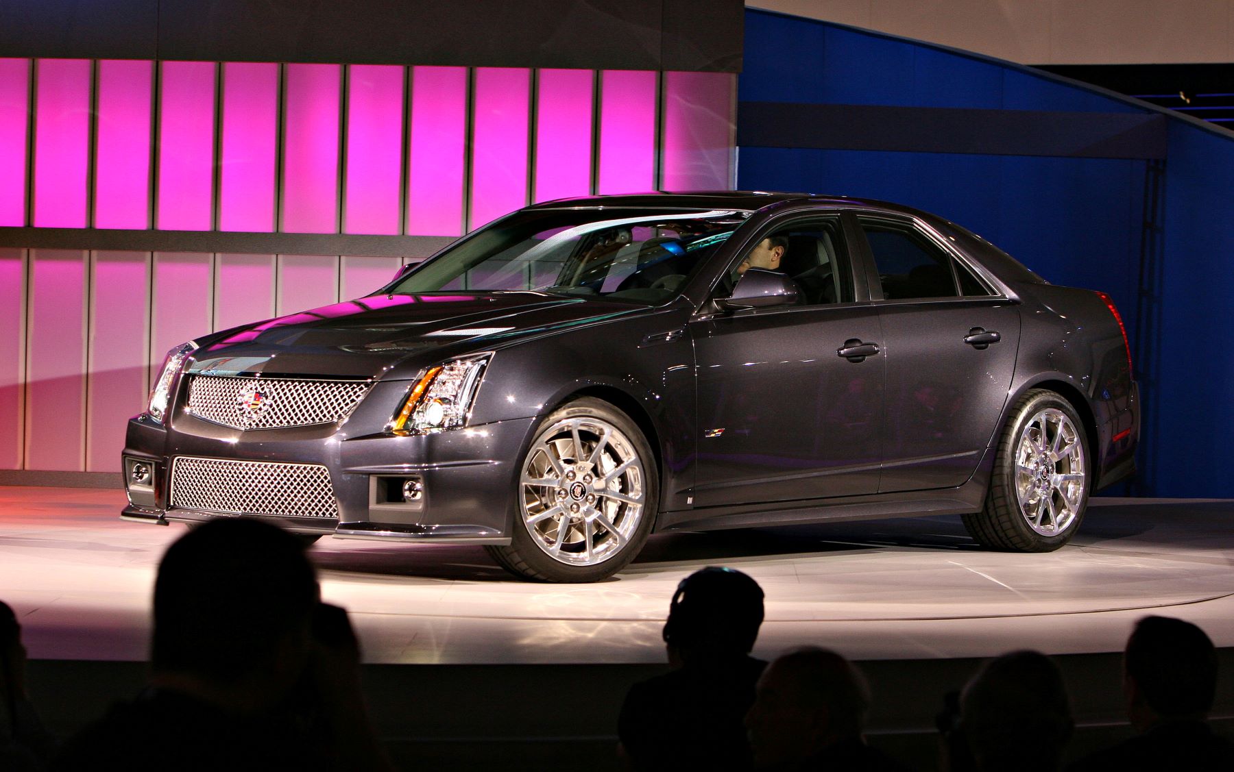 A 2009 Cadillac CTS-V luxury sedan driven on stage at the 2008 North American International Auto Show