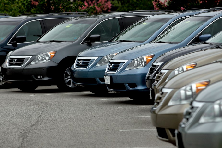 2010 Honda Odyssey minivan models in a used car lot somewhere in 2010. 