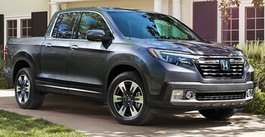 Gray 2018 Honda Ridgeline parked in front of a house