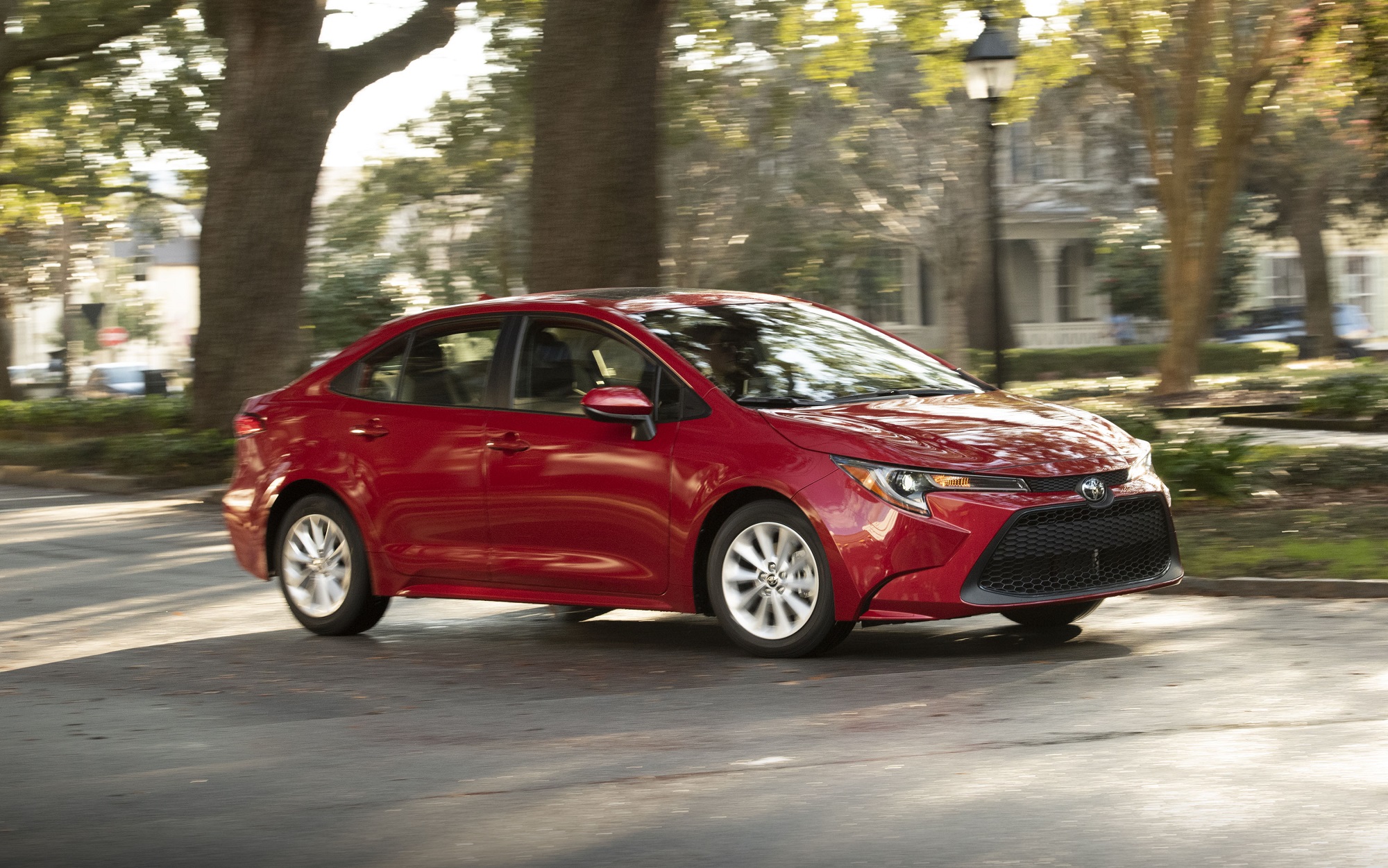 A Toyota Corolla, like this one cornering in a city, is one of the most popular used cars in states like California.