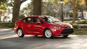 A Toyota Corolla, like this one cornering in a city, is one of the most popular used cars in states like California.