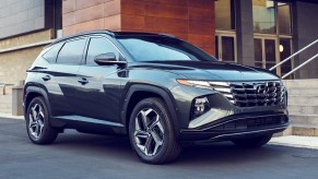 A gray 2022 Hyundai Tucson Plug-In Hybrid small SUV is parked.