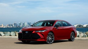 A 2022 Toyota Avalon shows off its luxury sedan styling at a waterfront.