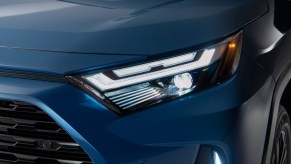 A blue 2022 Toyota RAV4 which is a Toyota with the lowest insurance cost with a recent accident.