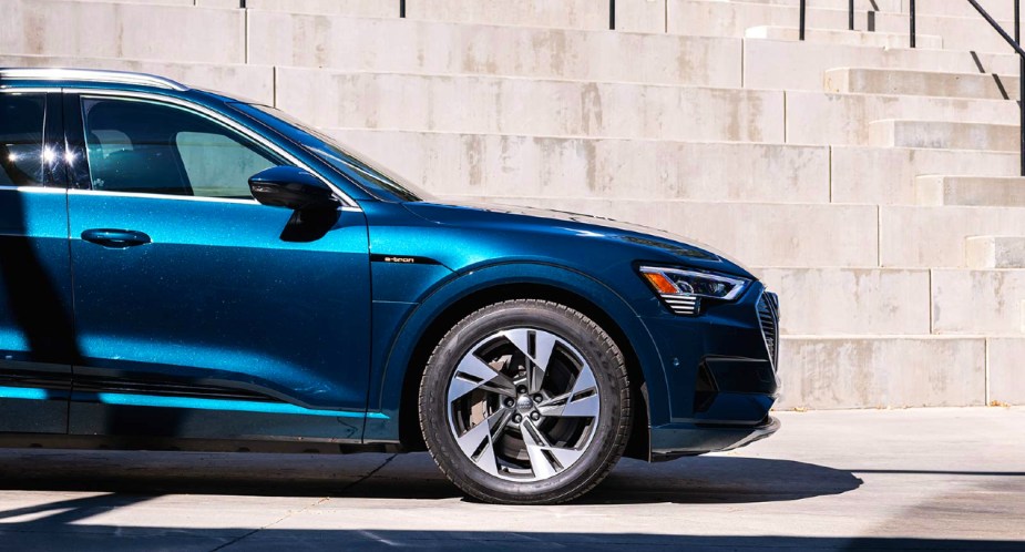 The front of a blue 2023 Audi E-Tron luxury electric midsize SUV.