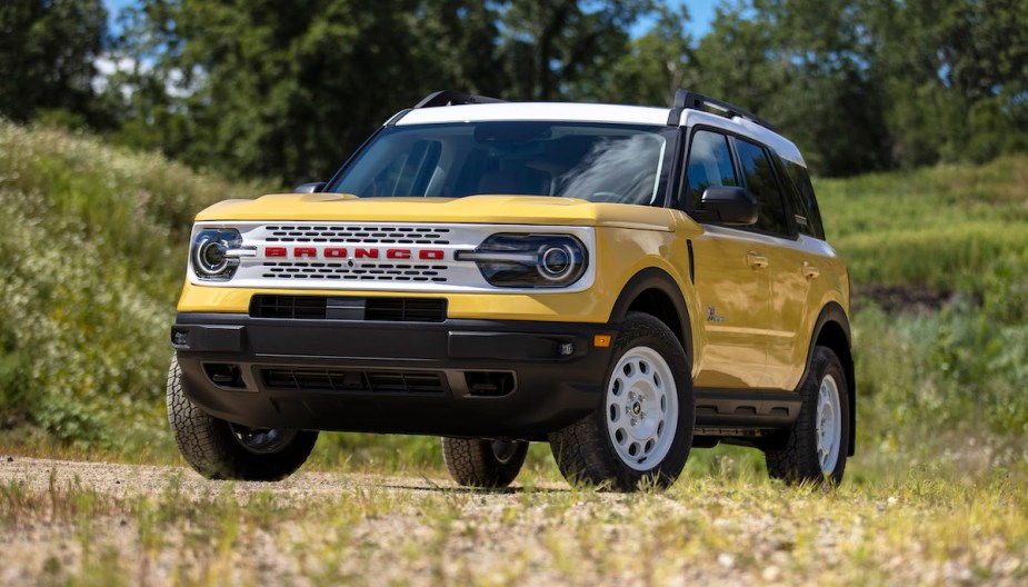 A yellow 2023 Bronco Sport parked outdoors, which could be the SUV to buy. 