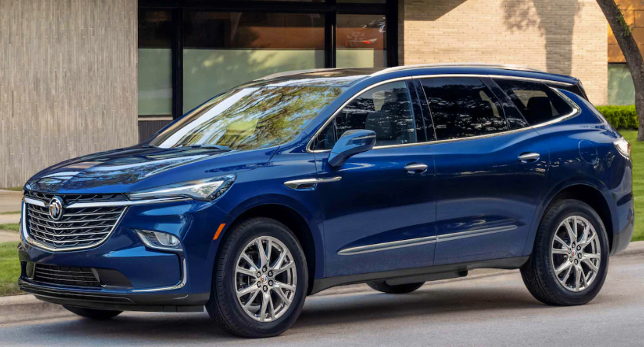 A blue 2023 Buick Enclave midsize luxury SUV is parked.