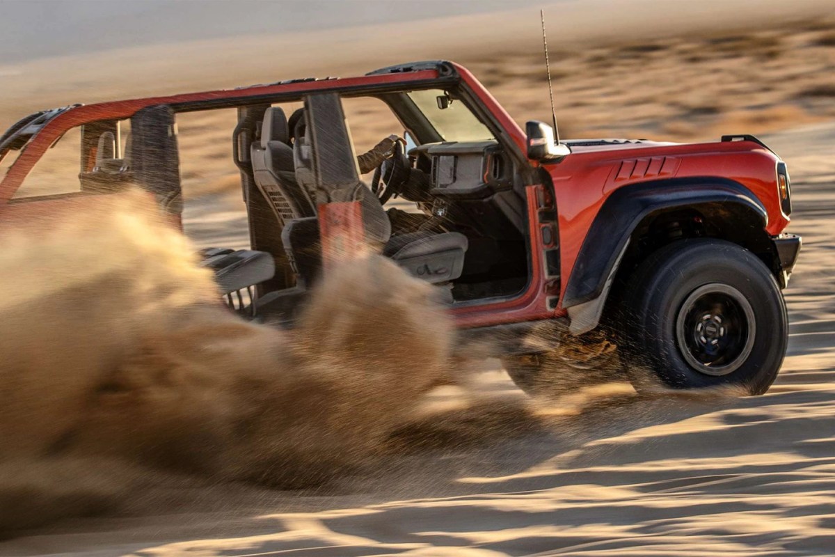 A 2023 Ford Bronco without doors ripping through the desert with no manual transmission.