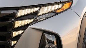 A silver 2023 Hyundai Tucson headlight, which is one of the small SUVs to buy.