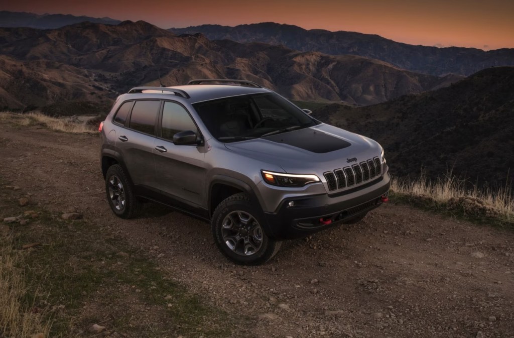 The 2023 Jeep Cherokee driving on a dirt road 