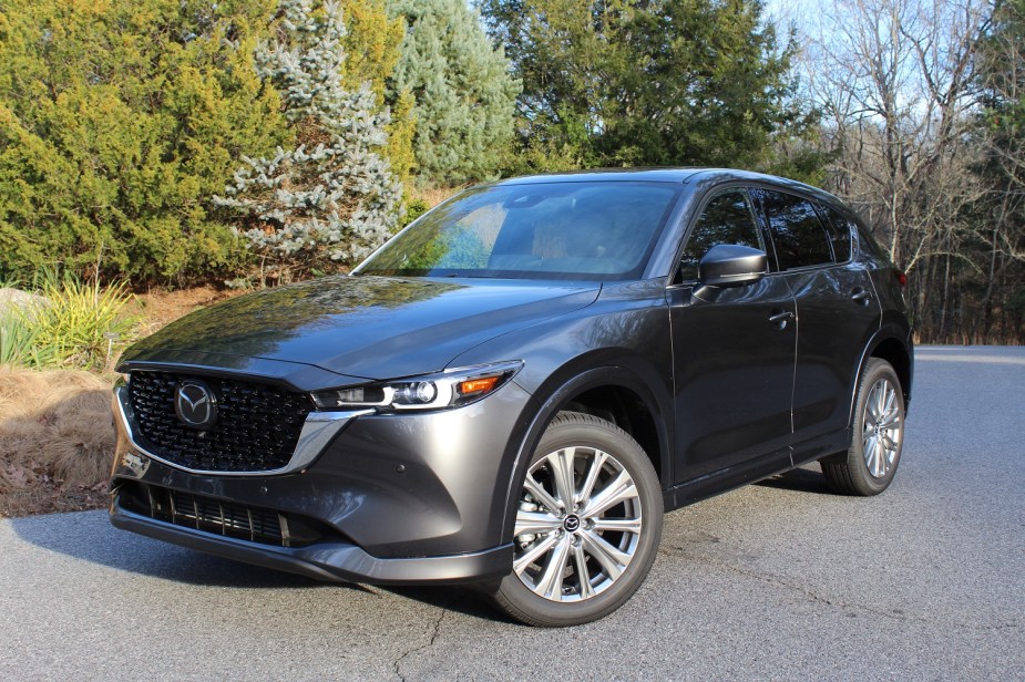 A gray 2023 Mazda CX-5 small SUV is parked outside. 