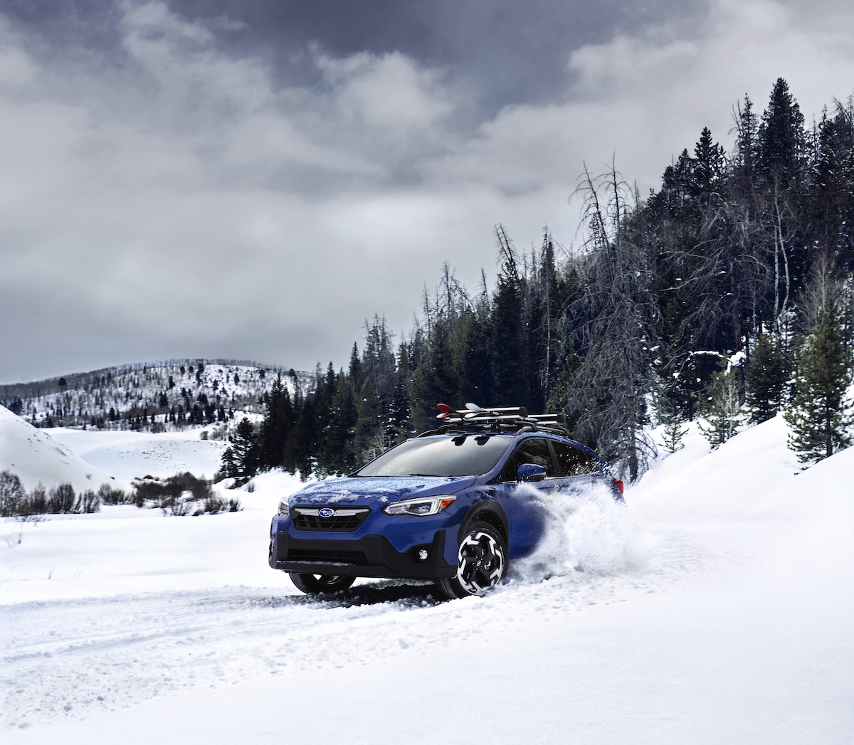 A blue 2023 Subaru Crosstrek, which is a 2023 SUV to buy in the snow. This is the predecessor to the new 2024 Crosstrek.