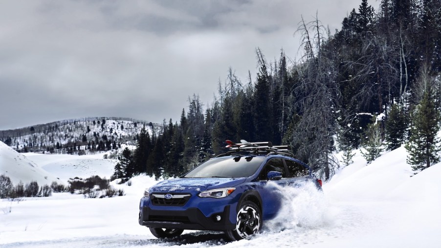 A blue 2023 Subaru Crosstrek, which is a 2023 SUV to buy in the snow.