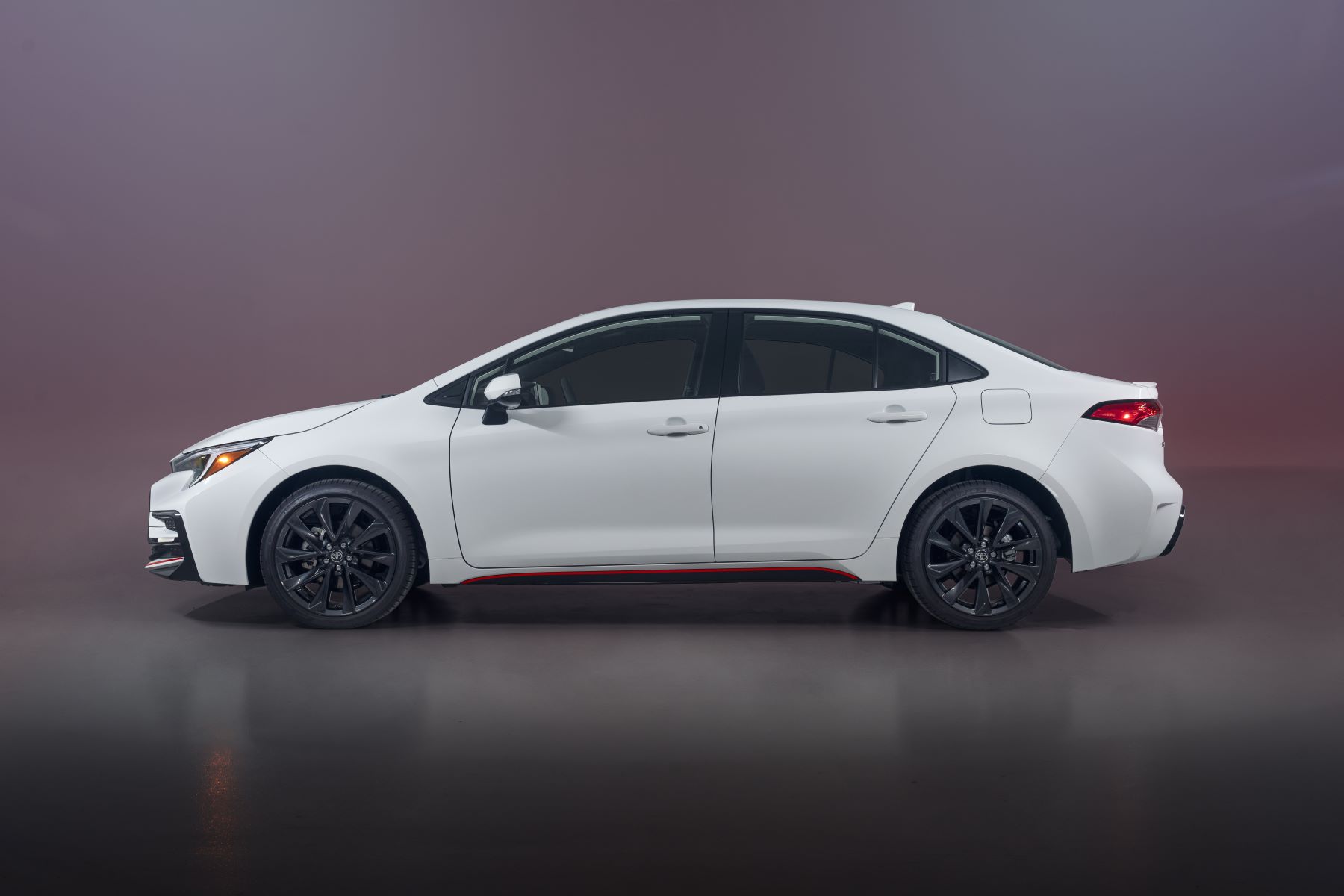 A side profile shot of the 2023 Toyota Corolla Hybrid Infrared Special Edition compact sedan model, the most reliable cheap hybrid compact car of 2022