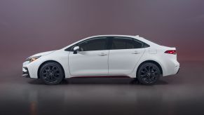 A side profile shot of the 2023 Toyota Corolla Hybrid Infrared Special Edition compact sedan model