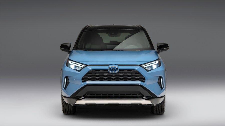 A light blue 2023 Toyota RAV4, which is the Toyota with the lowest insurance cost.
