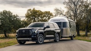 A Toyota Sequoia towing an airstream. This is one of the best towing SUVs on the market.