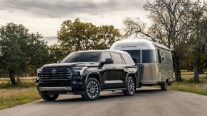 A Toyota Sequoia towing an airstream. This is one of the best towing SUVs on the market.