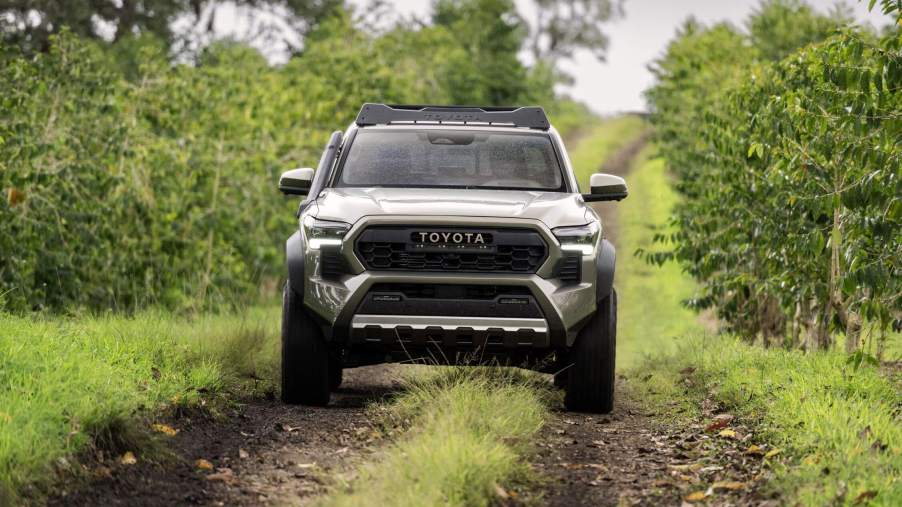 The 2024 Toyota Tacoma Trailhunter off-roading in mud